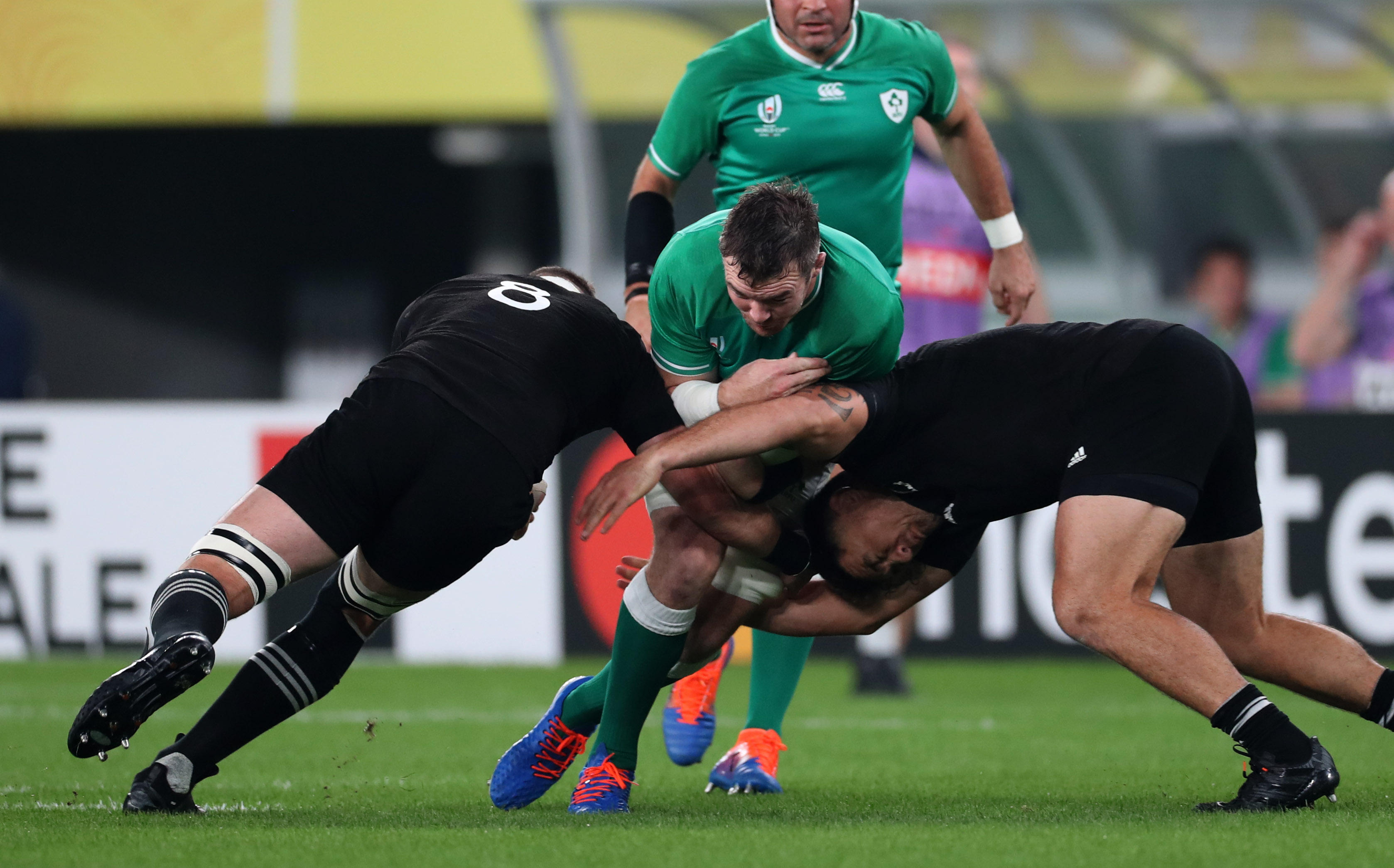 Ireland’s Peter O'Mahony is tackled by All Blacks Kieran Read and Codie Taylor 19/10/2019